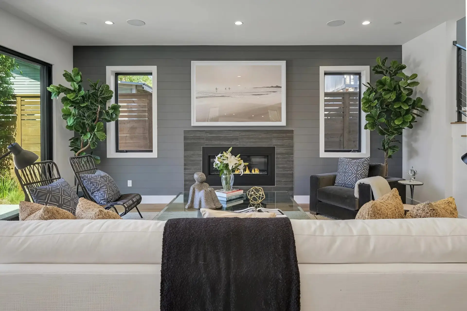 Modern living room with gray interior wall paint and white trim by an interior painter in Exeter, CA