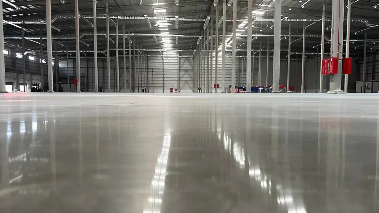 Industrial epoxy-coated warehouse floor with polished finish by painter in Clovis, CA