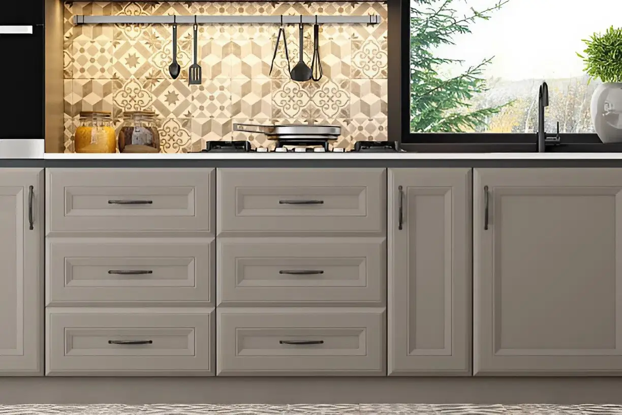 Kitchen cabinets painted in warm greige and soft ivory tones by a house painter in Hanford, CA