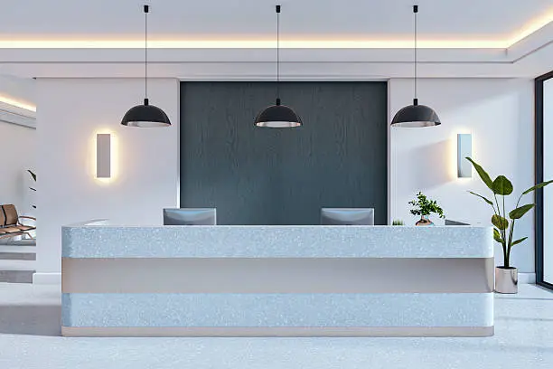 Modern office reception with clean neutral walls, a bold accent backdrop by a painting company in Clovis, CA