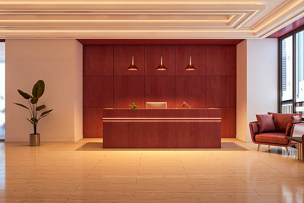 Elegant office reception with warm-toned interior painting and wood-paneled accent wall by a painting company in Clovis, CA