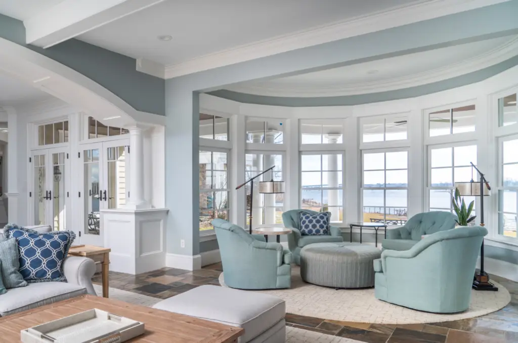 Living room with soft blue walls, crisp white trim, and coordinated interior color flow by an interior painter in Three Rivers, CA.