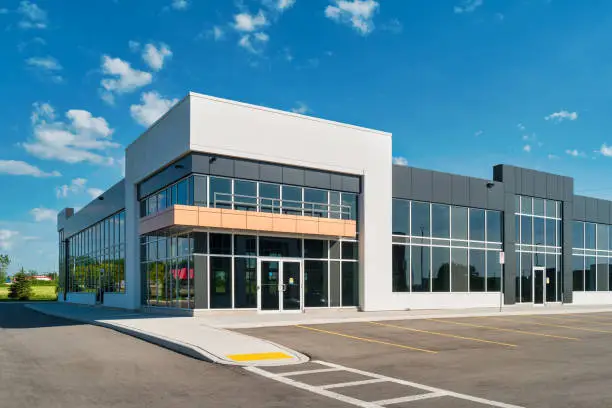 Office building with white and charcoal gray exterior paint colors by a painting company in Exeter, CA