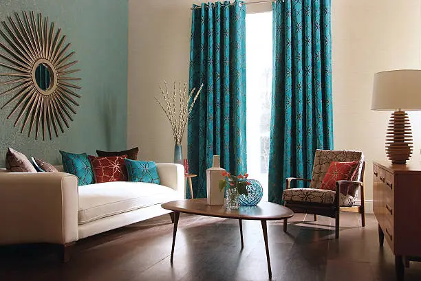 Living room with teal walls and wood accents by a house painter in Exeter, CA.
