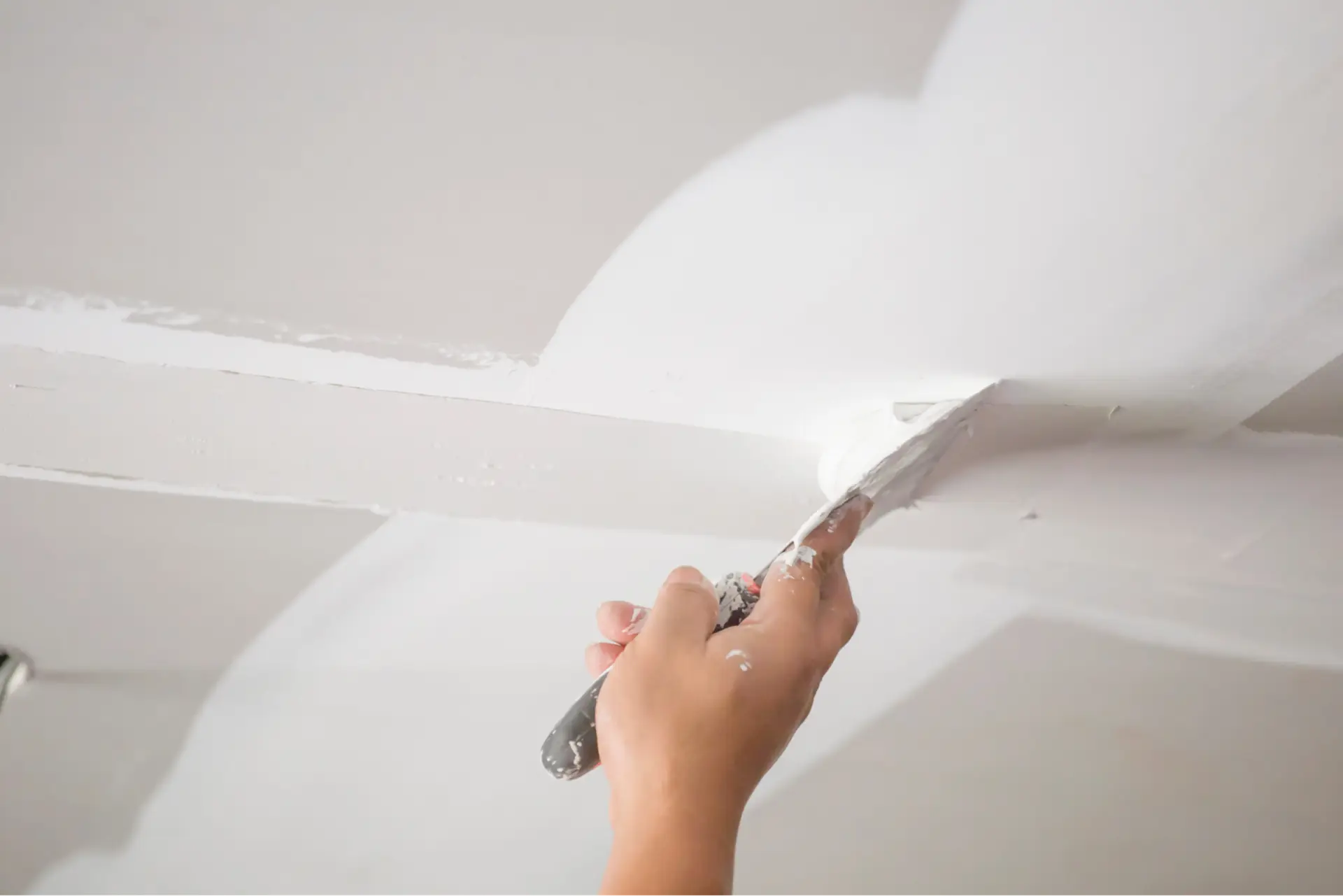 Professional drywall repair and texturing for a smooth interior wall before painting by a house painter in Lemoore, CA
