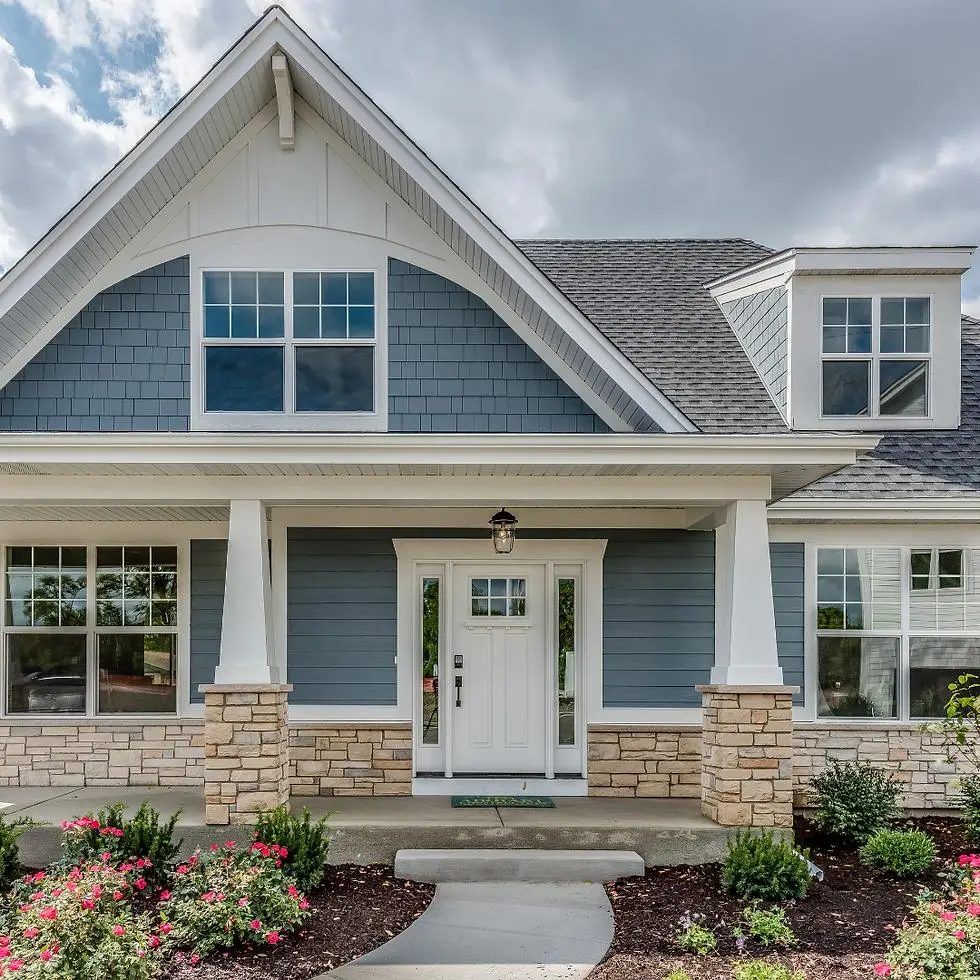 Blue-gray siding with crisp white exterior trim by an exterior painter in Tulare, CA